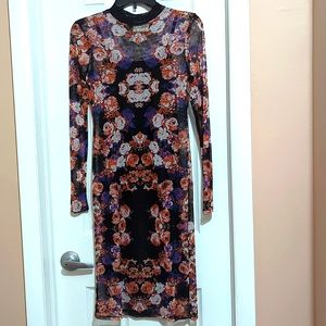 Dress Junior Size M.  Floral over black.  NWT